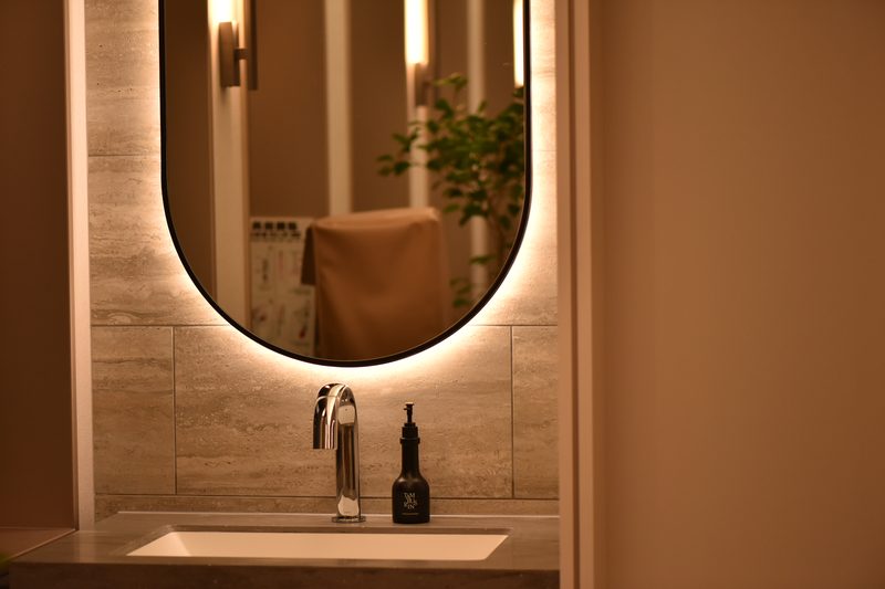 Powder room with backlit mirror